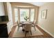Cozy dining area with a round table, comfortable chairs, and a bright bay window at 101 Dovetail Ct, Apopka, FL 32703