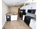 Modern kitchen features stainless steel appliances, granite countertops, and white cabinets at 101 Dovetail Ct, Apopka, FL 32703