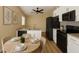 Modern kitchen features stainless steel appliances, granite countertops, and white cabinets at 101 Dovetail Ct, Apopka, FL 32703