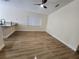 Open-concept living space features wood-look flooring and a ceiling fan at 101 Dovetail Ct, Apopka, FL 32703