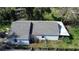 View of the roof of the home as well as some greenery around the perimeter of the yard at 101 Dovetail Ct, Apopka, FL 32703