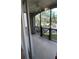 Balcony with black metal guard rail and screened in porch at 11446 Jasper Kay Terrace # 202, Windermere, FL 34786