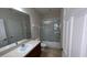 Bathroom with vanity, toilet, and shower with glass doors at 11446 Jasper Kay Terrace # 202, Windermere, FL 34786