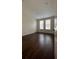 Bedroom with hardwood floors and windows providing natural light at 11446 Jasper Kay Terrace # 202, Windermere, FL 34786