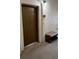 Unit 1019 entrance with brown door, adjacent bench, and secure foyer at 11446 Jasper Kay Terrace # 202, Windermere, FL 34786