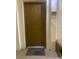 Apartment front door with a welcome mat outside, adjacent to a bench and the unit number at 11446 Jasper Kay Terrace # 202, Windermere, FL 34786