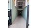 Inviting covered walkway with tiled floors and painted walls, providing access to the building's interior at 11446 Jasper Kay Terrace # 202, Windermere, FL 34786