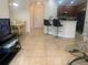 Open-concept living area with breakfast bar and dining space, leading to a cozy living room at 11446 Jasper Kay Terrace # 202, Windermere, FL 34786