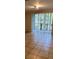 Sun-filled living room with tile flooring, sliders to balcony and views of the community at 11446 Jasper Kay Terrace # 202, Windermere, FL 34786