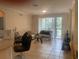 Bright living room featuring a sliding glass door with plenty of natural light and tile flooring at 11446 Jasper Kay Terrace # 202, Windermere, FL 34786