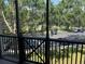 View from balcony overlooking parking area with trees at 11446 Jasper Kay Terrace # 202, Windermere, FL 34786