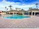 Large community swimming pool with lounge chairs and covered seating at 11446 Jasper Kay Terrace # 202, Windermere, FL 34786