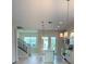 Bright, modern kitchen with an island, stainless steel appliances, and staircase at 1533 Heritage Pl, Oviedo, FL 32765