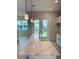 Kitchen island featuring white quartz countertop and sink in a bright, modern space at 1533 Heritage Pl, Oviedo, FL 32765