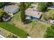 Expansive fenced backyard featuring mature trees and lush green space offering privacy and outdoor enjoyment at 1831 W Clinton Dr, St Cloud, FL 34769