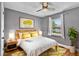 Charming bedroom with gray walls, wood floors, and natural light at 1831 W Clinton Dr, St Cloud, FL 34769