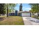 Charming home featuring a two-car garage, complemented by a well-manicured lawn and inviting curb appeal at 1831 W Clinton Dr, St Cloud, FL 34769