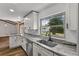 Bright kitchen featuring stainless steel appliances, white cabinets, and a modern faucet at 1831 W Clinton Dr, St Cloud, FL 34769