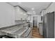 Updated kitchen featuring stainless steel appliances, white cabinets and stylish countertops at 1831 W Clinton Dr, St Cloud, FL 34769