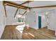 Inviting open concept living room featuring hardwood floors and vaulted ceilings at 1831 W Clinton Dr, St Cloud, FL 34769