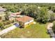 Aerial view of the home showcasing a long driveway and a well-maintained yard at 2004 Prescott Blvd, Deltona, FL 32738