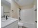 Bathroom features a tub with shower and vanity with dark fixtures at 2004 Prescott Blvd, Deltona, FL 32738