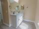 Bathroom featuring a double sink vanity with modern fixtures and a mirror at 2004 Prescott Blvd, Deltona, FL 32738