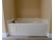 Bathroom with a luxurious soaking tub surrounded by tile at 2004 Prescott Blvd, Deltona, FL 32738