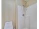 Bright bathroom features a shower with dual shower heads and a toilet at 2004 Prescott Blvd, Deltona, FL 32738