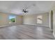 Bright bedroom boasts gray floors, neutral walls, and abundant natural light from multiple windows at 2004 Prescott Blvd, Deltona, FL 32738
