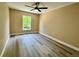 Bedroom with luxury vinyl flooring, a ceiling fan, and one window at 2004 Prescott Blvd, Deltona, FL 32738