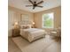 Charming bedroom features a comfortable bed with nightstands, decor, and a large window at 2004 Prescott Blvd, Deltona, FL 32738