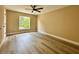 Bedroom with luxury vinyl flooring, a ceiling fan, and one window at 2004 Prescott Blvd, Deltona, FL 32738