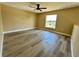 Bedroom with luxury vinyl flooring, and one window providing natural light at 2004 Prescott Blvd, Deltona, FL 32738