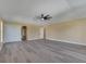 Spacious bonus room with gray floors, neutral walls, and a large closet for storage at 2004 Prescott Blvd, Deltona, FL 32738