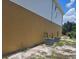 Side exterior of two-story house with two central AC units on a sandy patch of lawn at 2004 Prescott Blvd, Deltona, FL 32738