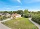 Aerial view of the home featuring a well-manicured lawn and mature trees at 2004 Prescott Blvd, Deltona, FL 32738