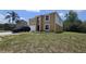 Two-story home with a well-manicured lawn, featuring an attached garage and trimmed garden beds at 2004 Prescott Blvd, Deltona, FL 32738