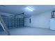 Spacious garage with ample room for parking, plus a water heater, and secure metal roll up garage door at 2004 Prescott Blvd, Deltona, FL 32738