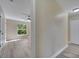 Hallway leading to the bedroom with view to the outdoors at 2004 Prescott Blvd, Deltona, FL 32738