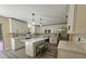 A remodeled kitchen with modern white cabinetry, stainless steel appliances, and a stylish center island at 2004 Prescott Blvd, Deltona, FL 32738