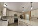 Bright kitchen features new white cabinets, granite countertops, stainless steel appliances, and center island at 2004 Prescott Blvd, Deltona, FL 32738