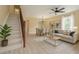 Bright living room with hardwood floors, a ceiling fan, dining area, a comfortable sofa, and decor at 2004 Prescott Blvd, Deltona, FL 32738