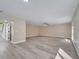 Bright and airy living room featuring an open layout and modern ceiling fan at 2004 Prescott Blvd, Deltona, FL 32738
