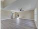 Bright and airy living room with a modern ceiling fan and ample natural light at 2004 Prescott Blvd, Deltona, FL 32738