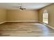 Spacious living room with luxury vinyl flooring, a ceiling fan, and abundant natural light at 2004 Prescott Blvd, Deltona, FL 32738