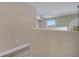 Loft area showcasing wood-look flooring, natural light, and open design at 2004 Prescott Blvd, Deltona, FL 32738