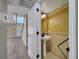 Stylish powder room with pedestal sink and decorative accents, plus a stairway view at 2004 Prescott Blvd, Deltona, FL 32738