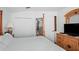 Bedroom featuring a four-poster bed and multiple closets at 202 Aylesbury Ln, Davenport, FL 33837