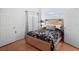 Cozy bedroom with natural light and wood-look flooring at 202 Aylesbury Ln, Davenport, FL 33837